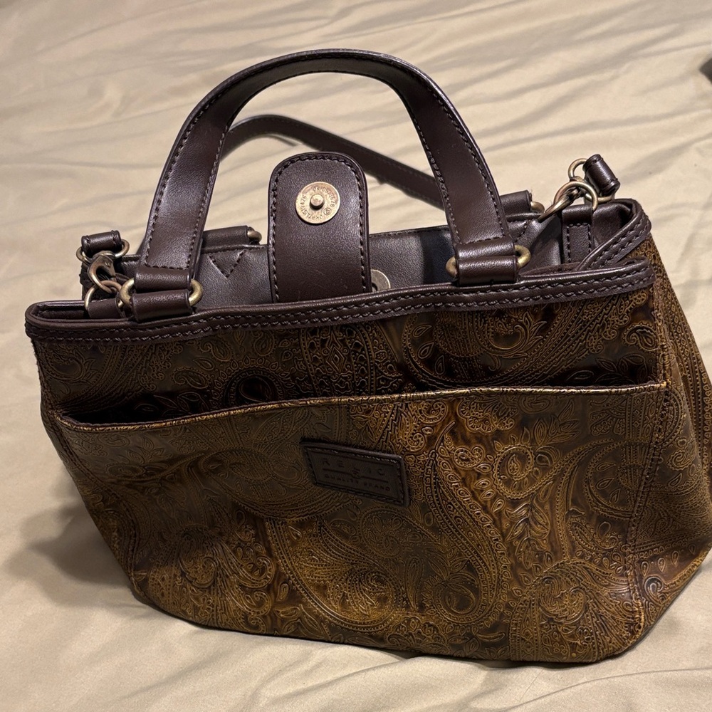 RELIC Quality Brand brown paisley purse with two handles and a shoulder strap.